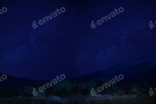 Preview: Beautiful dark starry sky above mountains at night