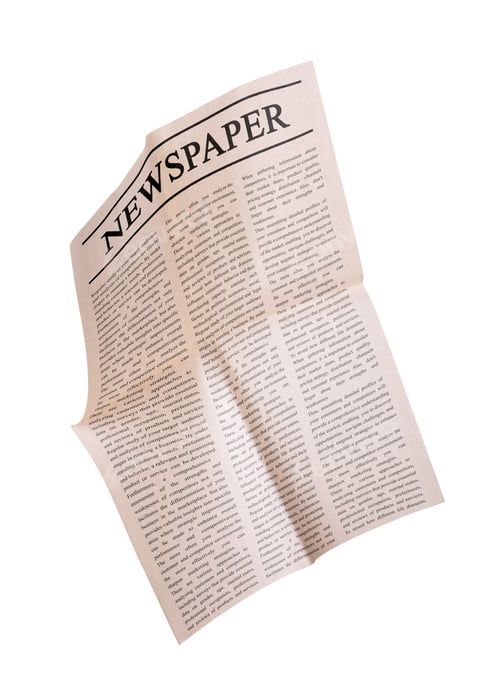 Preview: Newspaper flying in air against white background