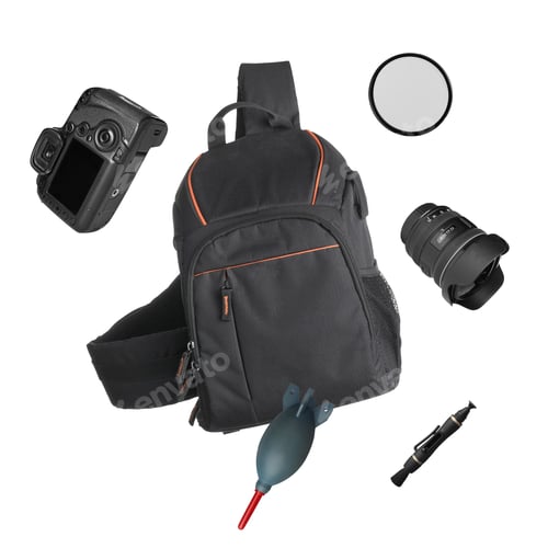 Preview: Photographer's backpack and professional equipment flying against white background