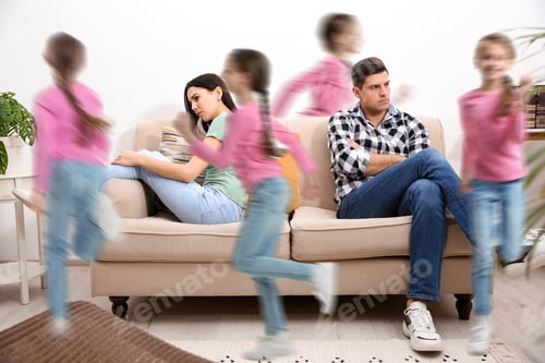 Preview: Family with hyperactive child. Daughter running around tired parents at home