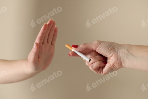 Preview: Woman refusing cigarette on blurred background, closeup