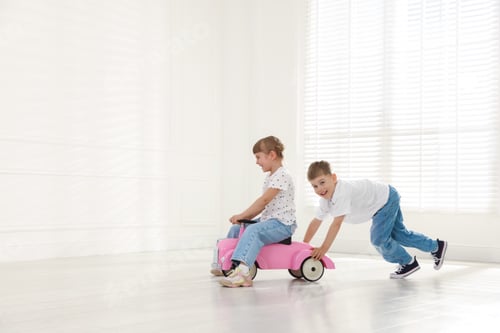 Preview: Little children with toy car at home, space for text
