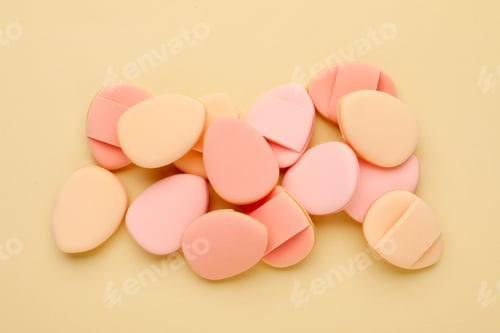 Preview: Clean makeup sponges on beige background, flat lay