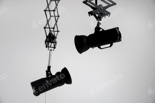 Preview: Professional lighting equipment hanging from ceiling in photo studio
