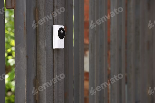Preview: Modern intercom system on gate outdoors, closeup