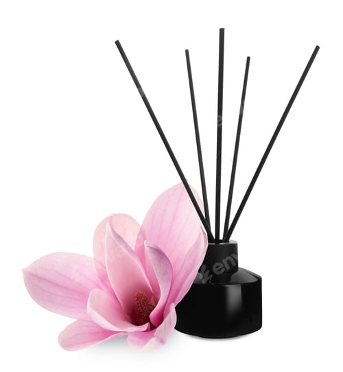 Preview: Aromatic reed freshener and magnolia flower isolated on white. Floral home fragrance