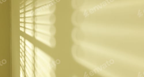 Preview: Light and shadows from window blinds falling on green wall, closeup