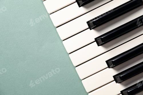 Preview: Piano keys on color background, top view. Space for text