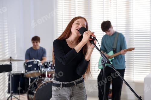 Preview: Teenage music band practicing their performance indoors