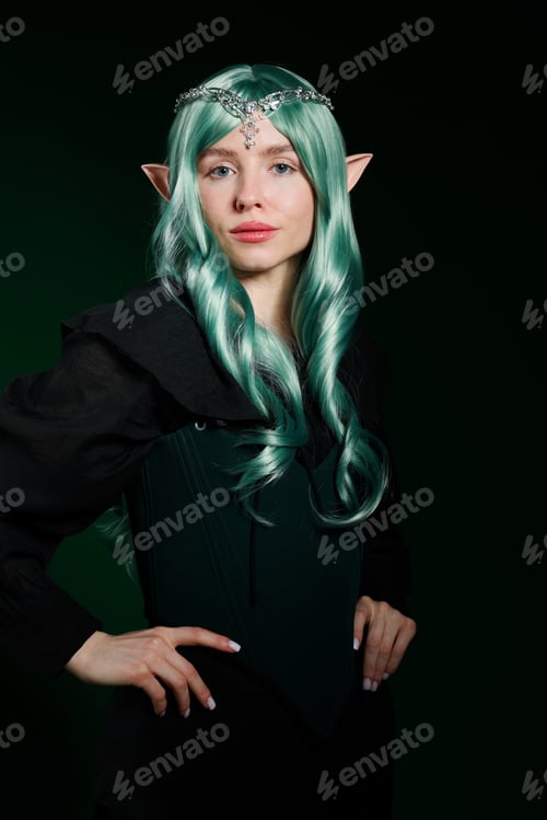 Preview: Beautiful girl dressed as elf on dark green background