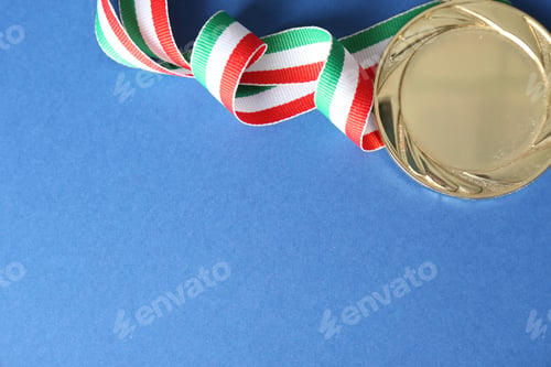 Preview: Gold medal on blue background, top view. Space for design