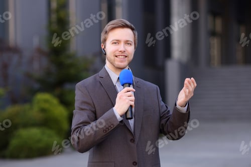 Preview: Professional journalist with microphone working on city street