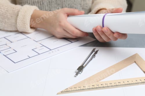 Preview: Woman working on project at grey table, closeup
