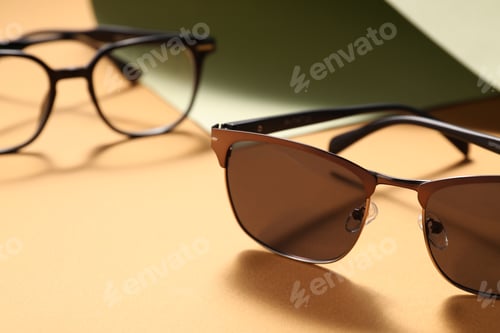 Preview: Different stylish glasses on color background, closeup
