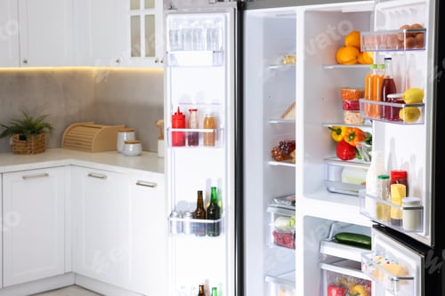 Preview: Modern refrigerator with different fresh food products in kitchen, space for text
