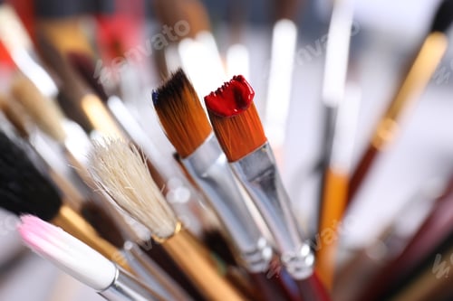 Preview: Different paint brushes on blurred background, closeup