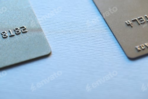 Preview: Two credit cards on light background, closeup