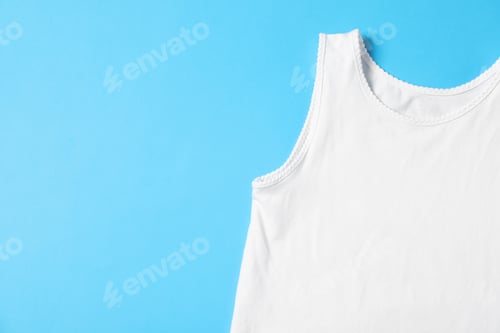 Preview: Baby tank top on light blue background, top view. Space for text