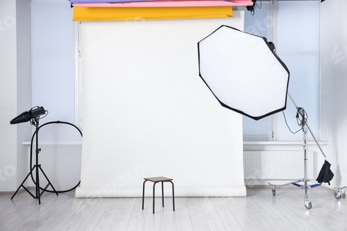 Preview: Different lighting equipment and chair in photo studio