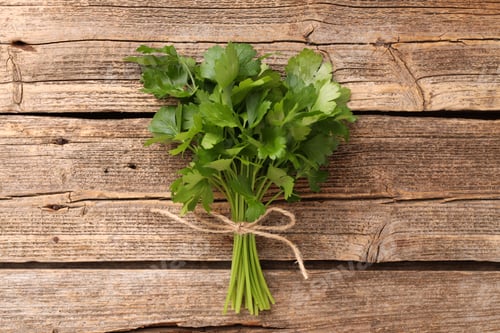 Preview: Bunch of fresh parsley on wooden table, top view