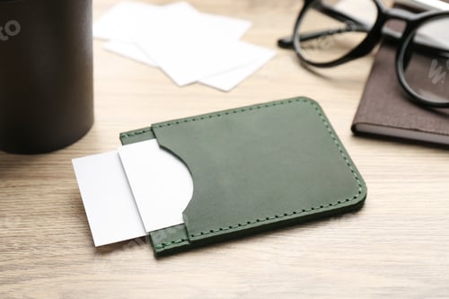 Preview: Leather business card holder with cards on wooden table