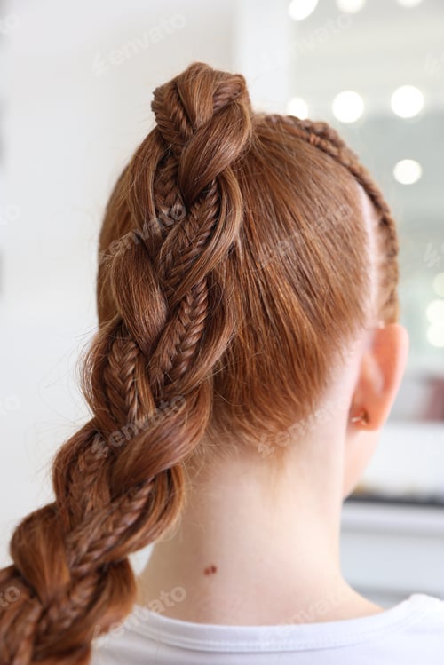 Preview: Teenage girl with beautiful braids in salon, back view