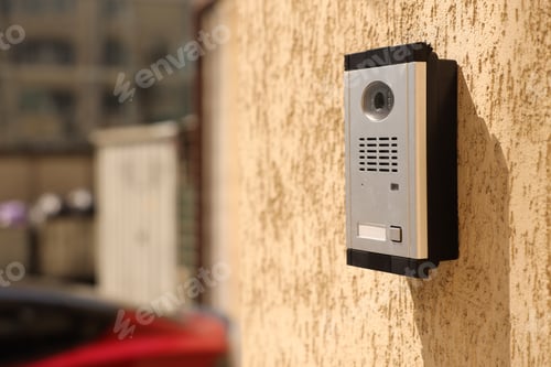 Preview: Modern intercom system on building outdoors, closeup. Space for text