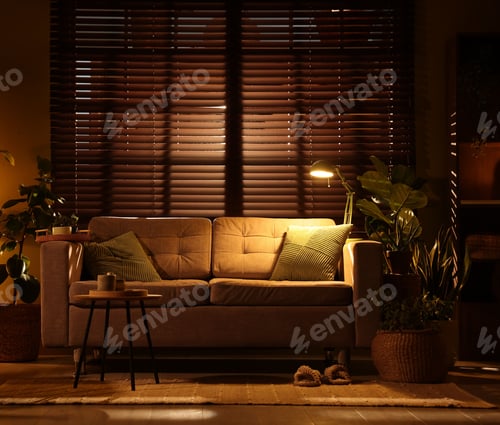 Preview: Stylish living room with sofa and houseplants. Interior design