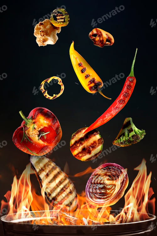 Preview: Vegetables flying above barbecue grill against black background