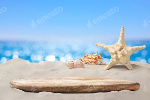 Preview: Empty wooden tray, starfish and shells on sandy beach near sea. Space for design