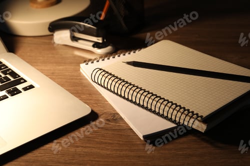 Preview: Notebooks and pencil on wooden table, closeup