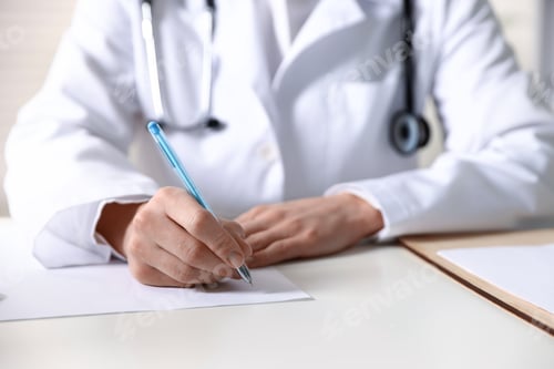 Preview: Doctor writing on sheet of paper at table in clinic, closeup