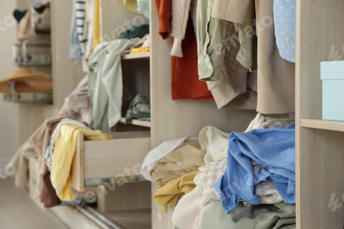 Preview: Many different messy clothes in wardrobe indoors, closeup