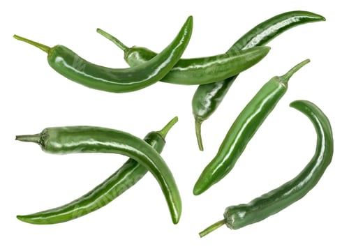 Preview: Green chili peppers flying in air on white background