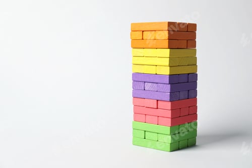 Preview: Tower of colorful blocks on light background. Space for text