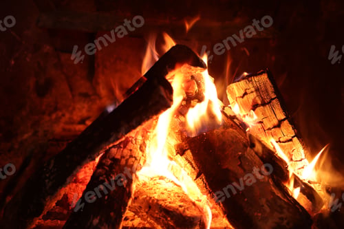 Preview: Wood burning in fireplace at home, closeup