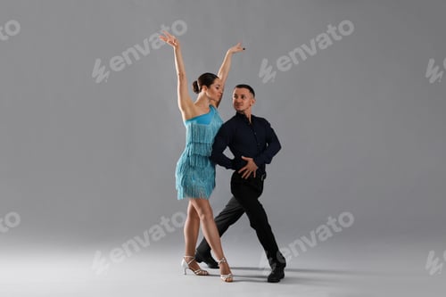 Preview: Couple of professional dancers on grey background