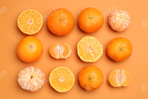 Preview: Fresh tangerines on orange background, flat lay