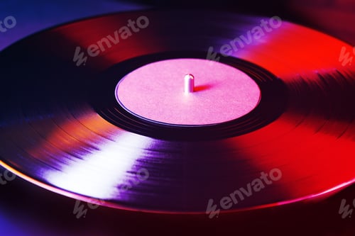 Preview: Vinyl record on turntable, closeup. Color toning