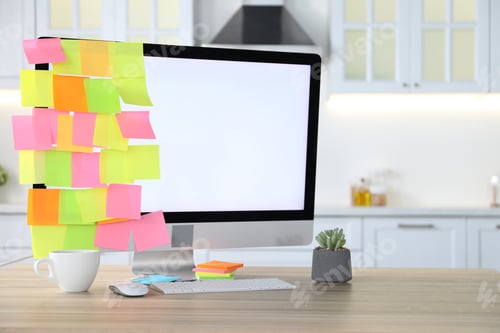 Preview: Computer with colorful sticky notes, cup of coffee and houseplant on wooden table indoors, space for