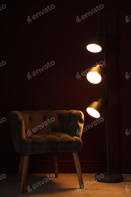 Preview: Stylish floor lamp and armchair indoors. Interior design
