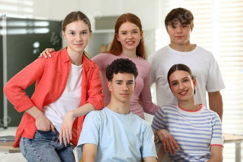 Preview: Portrait of happy students together in classroom
