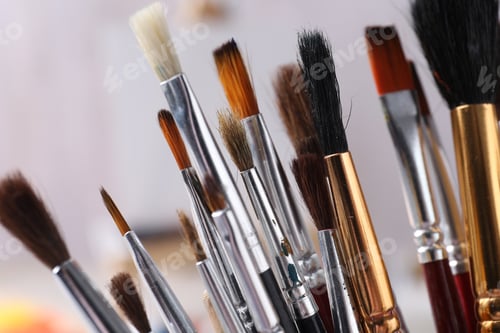 Preview: Different paint brushes on light background, closeup