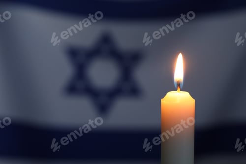 Preview: Holocaust Remembrance Day. Burning candle against flag of Israel, closeup. Space for text