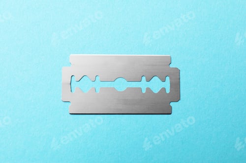 Preview: One sharp blade on light blue background, top view