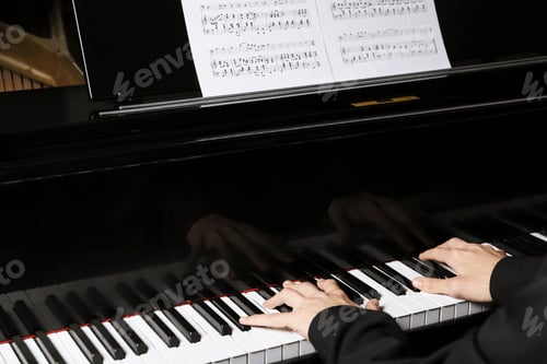 Preview: Musician playing piano indoors, closeup. Musical instrument