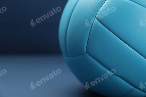 Preview: One volleyball ball on blue table, closeup. Space for text