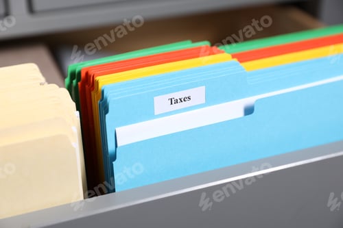 Preview: Tax. Many folders in drawer of cabinet in office, closeup