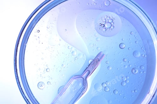 Preview: Dripping liquid from pipette into Petri dish on color background, top view