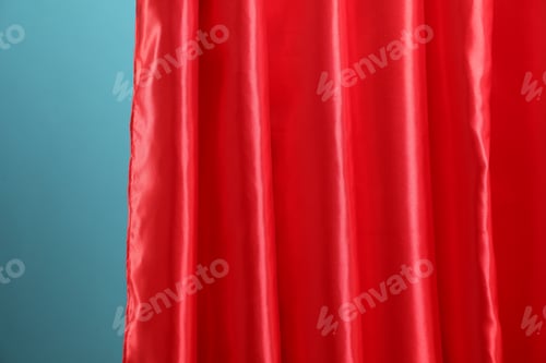 Preview: Stylish red front curtains on light blue background, closeup